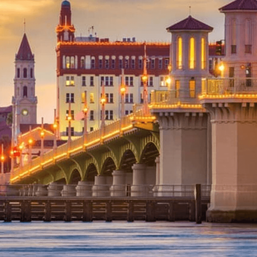 Bridge into historic St. Augustine, with tower and historic buildings in the background