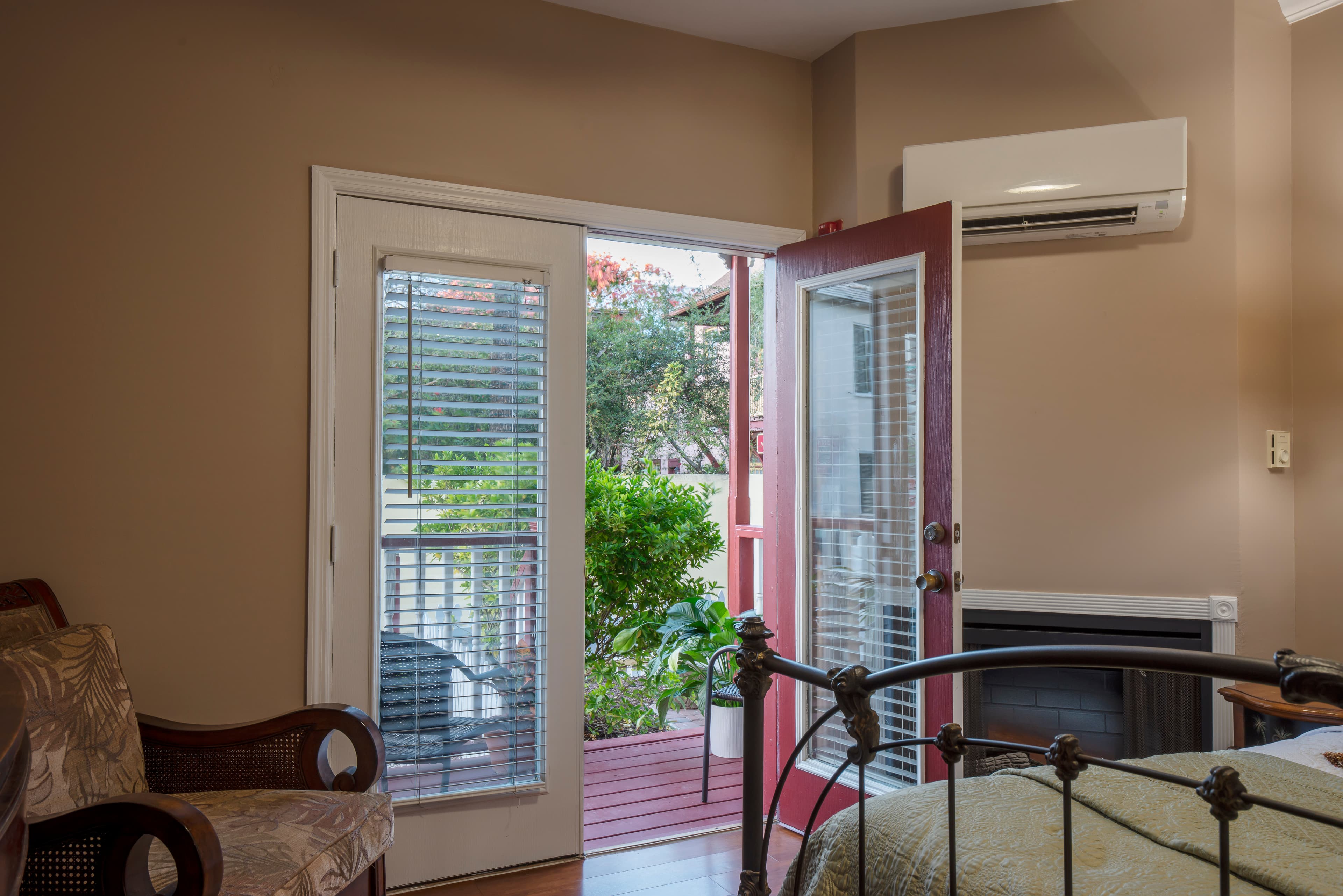 View from bedroom through French doors leading out to private porch entrance