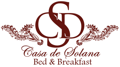 Logo for Casa de Solana Bed & Breakfast featuring intricate floral designs and elegant lettering.