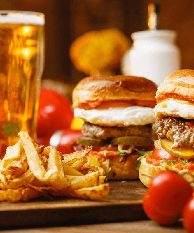 Burgers, fries and a glass of beer